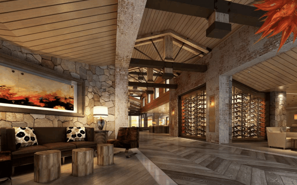 Rustic entryway with exposed wood beams and stacked stone columns.